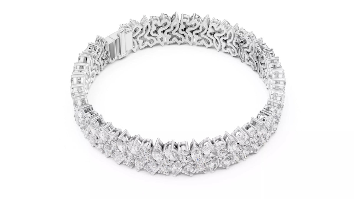 White gold pear and marquise diamond cluster bracelet top view showing round shape