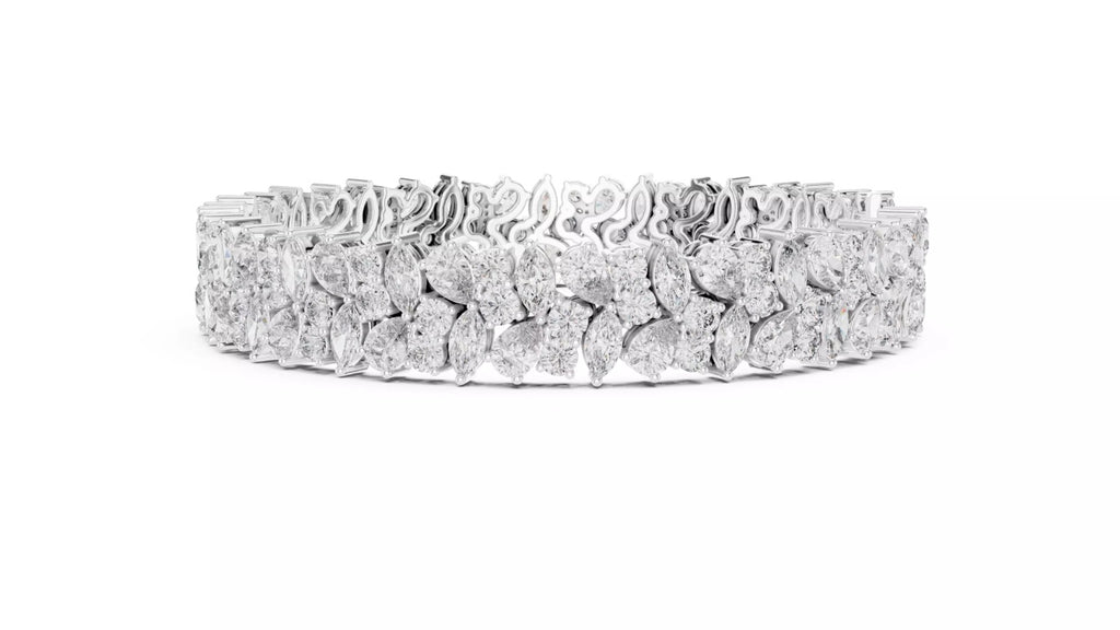 White gold wide diamond tennis bracelet side view with natural pear and marquise cut diamonds