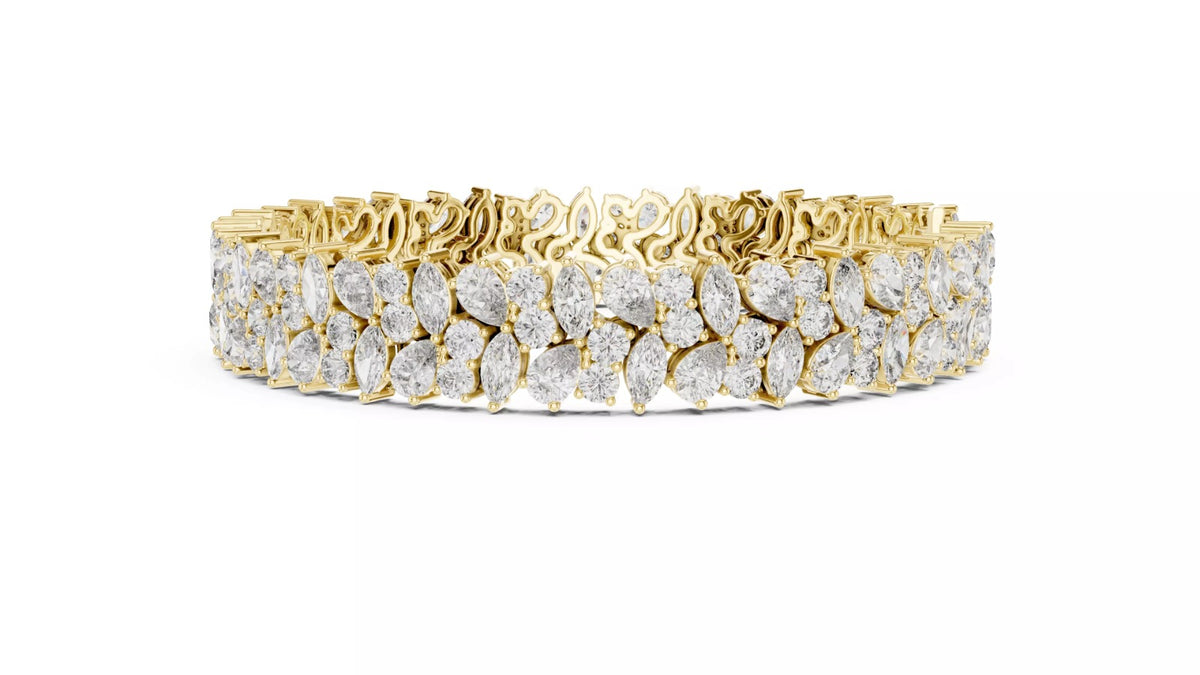 Yellow gold natural diamond tennis bracelet side view, pear and marquise cluster design