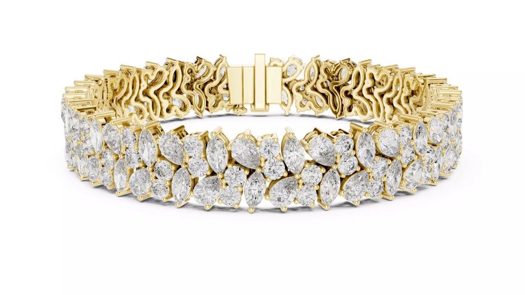 Wide yellow gold statement bracelet with natural pear and marquise cut diamonds, front close-up