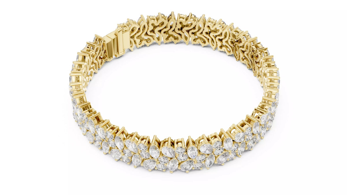 Yellow gold pear and marquise diamond bracelet angled view showing hidden box clasp