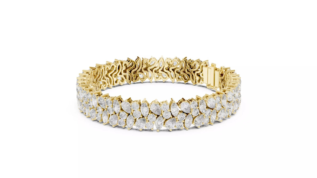 Natural pear and marquise diamond cluster bracelet in yellow gold, front view