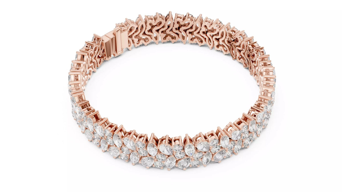 Rose gold marquise and pear diamond bracelet top view showing round shape and clasp