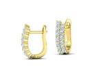 Double row diamond U hoop huggie earrings in yellow gold showing hinged latch back and front diamonds