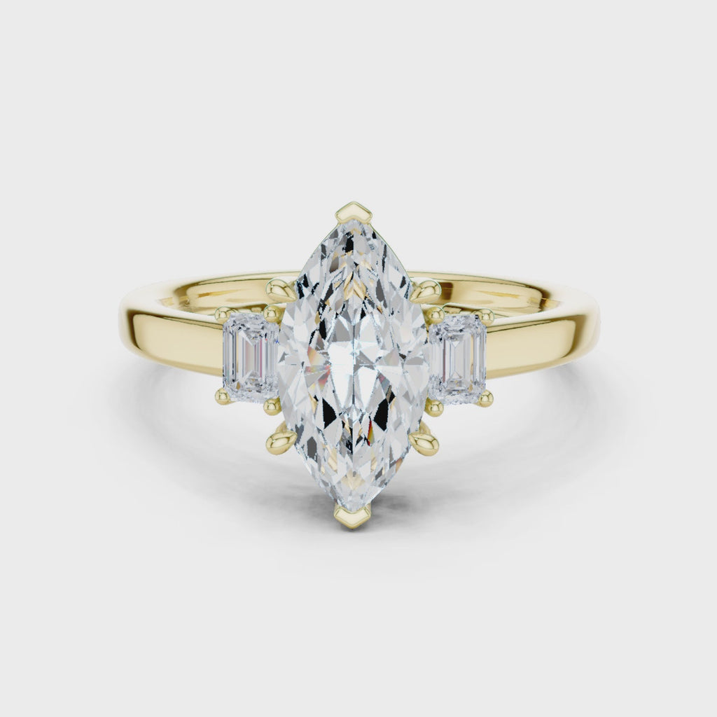 Marquise Cut Three Stone Engagement Ring with Tapered Baguettes