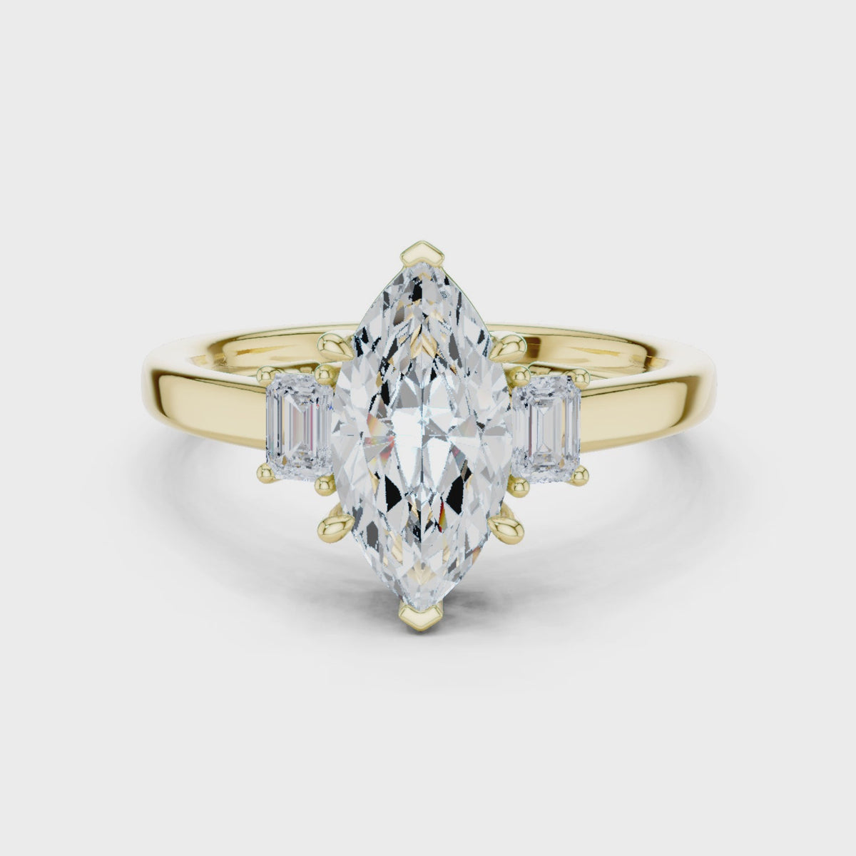 Marquise Cut Three Stone Engagement Ring with Tapered Baguettes