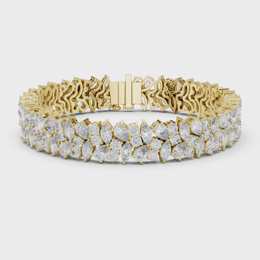 360 video of natural pear and marquise diamond cluster bracelet in yellow gold by Jewelzit