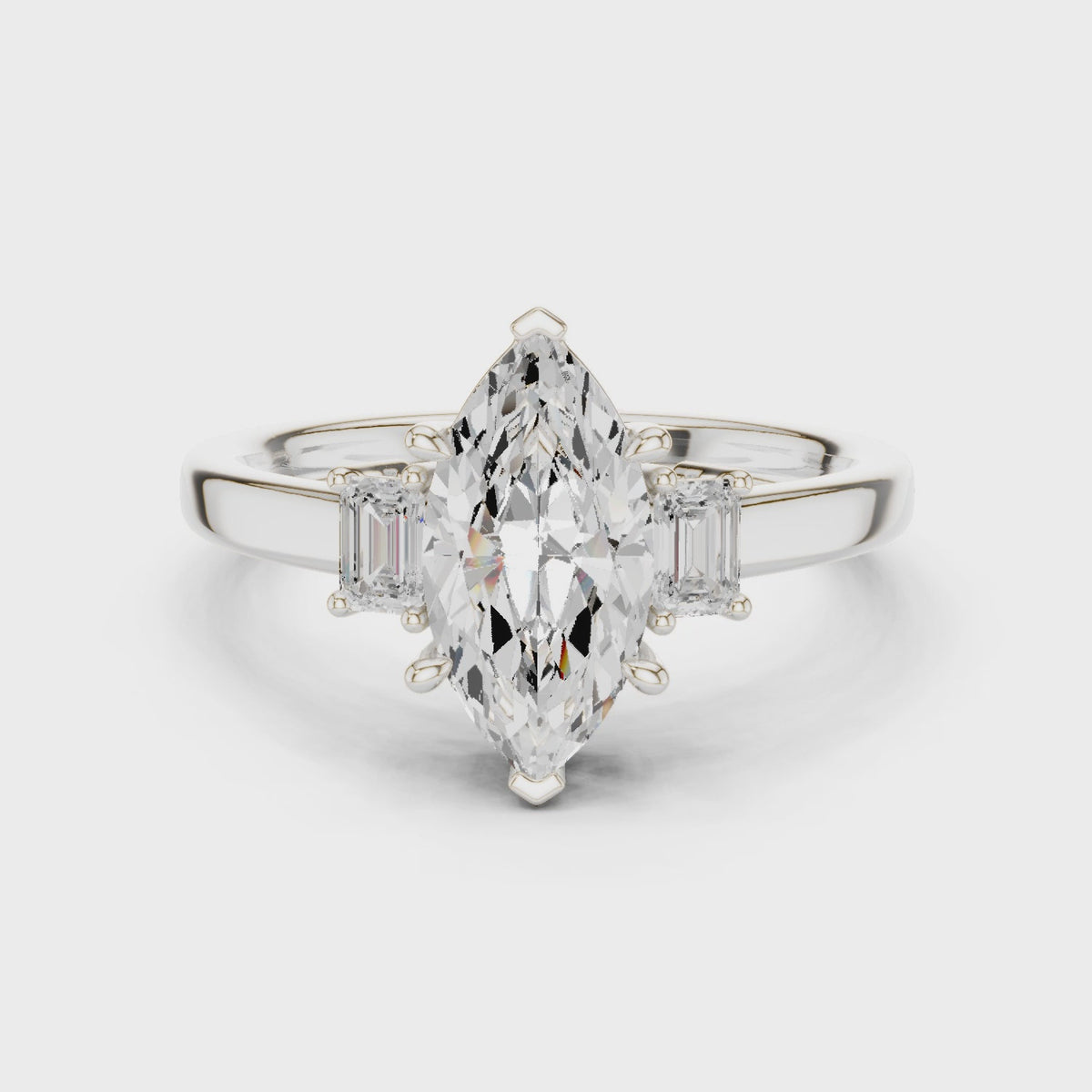 Marquise Cut Three Stone Engagement Ring with Tapered Baguettes