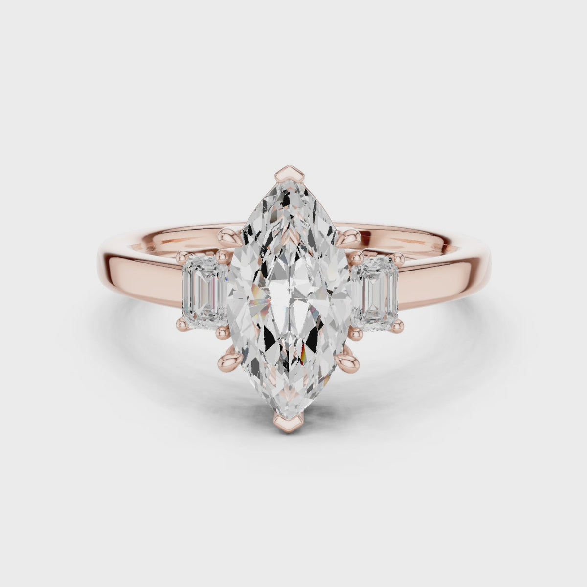 Marquise Cut Three Stone Engagement Ring with Tapered Baguettes